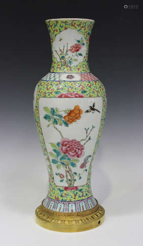 A Chinese famille rose porcelain vase, mid-19th century, of slender baluster form, painted with