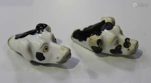 Two Staffordshire porcelain dog whistles, circa 1830, both modelled as the head of a white hound