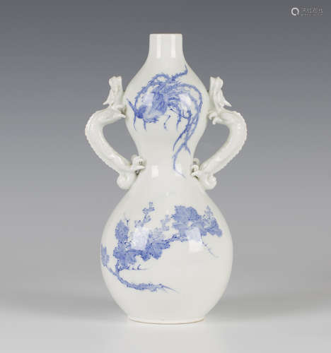 A Japanese Hirado blue and white porcelain vase, Meiji period, the double gourd shaped body