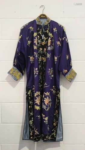 A Chinese purple silk embroidered robe, early 20th century, worked in coloured threads with bat