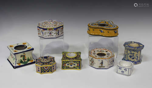 Eight assorted mostly French faience inkwells, late 19th and 20th century, variously shaped and