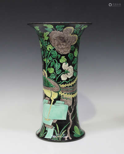 A Chinese famille noire enamelled biscuit porcelain beaker vase, late Qing dynasty, of plain trumpet