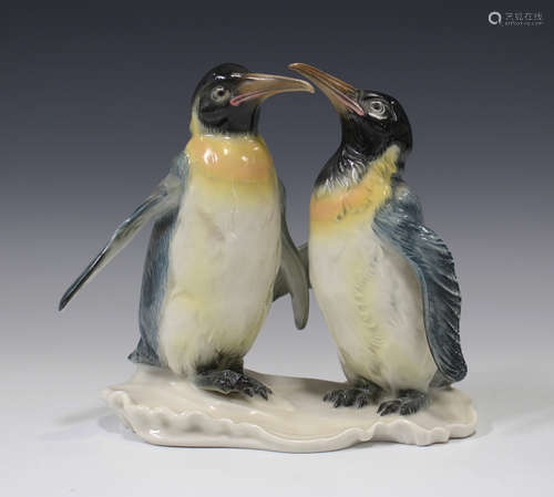 A Karl Ens porcelain model of two penguins, on a naturalistic base, printed mark to base, height