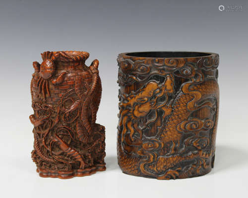 A Chinese stained bamboo brush pot, probably 20th century, carved in relief with a dragon and