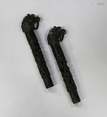 A pair of Chinese archaistic bronze fittings, each cast and pierced cylindrical shaft with slip-on