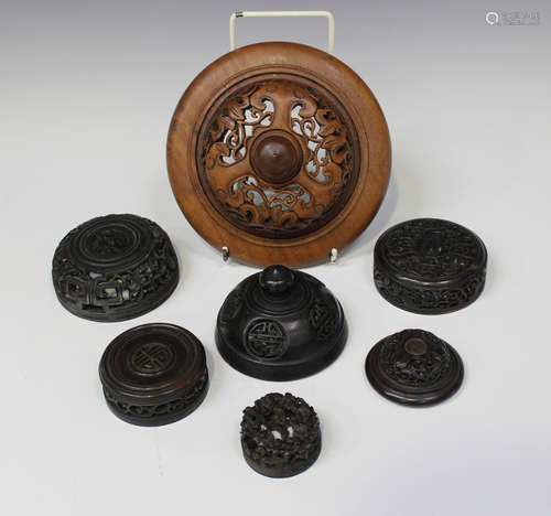 A group of seven Chinese hardwood covers/lids, late 19th/20th century, all with carved and pierced