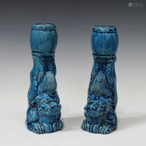 A pair of Chinese turquoise glazed spill vases, late Qing dynasty, each modelled as a Buddhistic