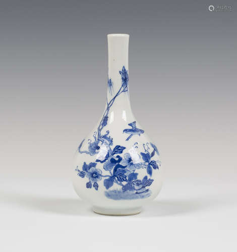 A Chinese blue and white export porcelain bottle vase, Qing dynasty, painted with a bird flying