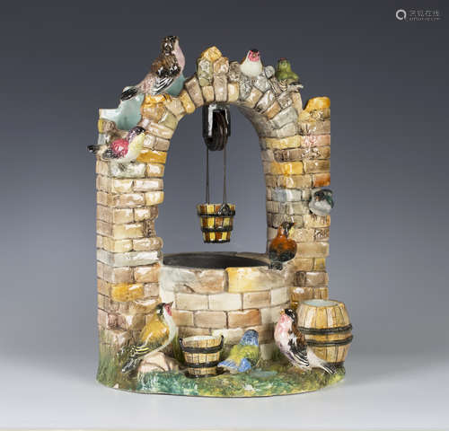 A large Massier Vallauris French majolica pottery wishing well, circa 1880, modelled as a rustic