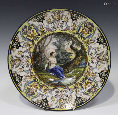 An Italian maiolica circular dish, late 19th/early 20th century, the central well painted with a