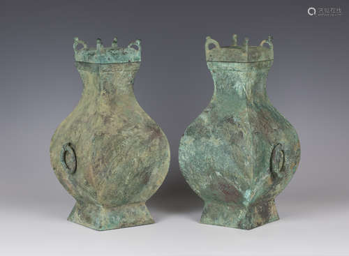 A pair of Chinese bronze wine jars and covers (fang hu), Han dynasty (206 BC- 220 AD), each of