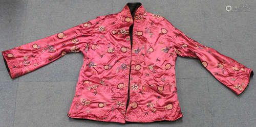 A Chinese pink silk embroidered short jacket, 20th century, decorated with birds, flowers and shou