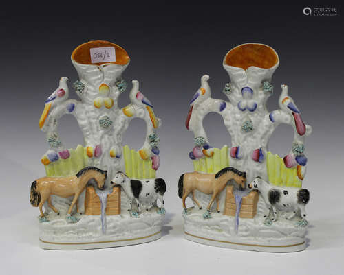 A pair of Staffordshire pottery spill vases, second half 19th century, modelled as a horse and cow