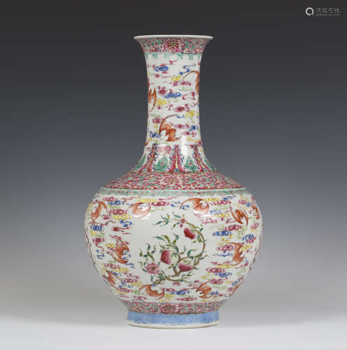 A Chinese famille rose enamelled porcelain bottle vase, mark of Guangxu and probably of the