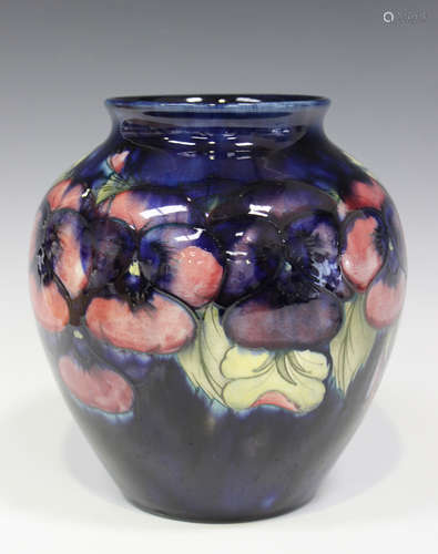 A Moorcroft pottery Pansy pattern vase, circa 1918-29, of high shouldered form with a blue ground,