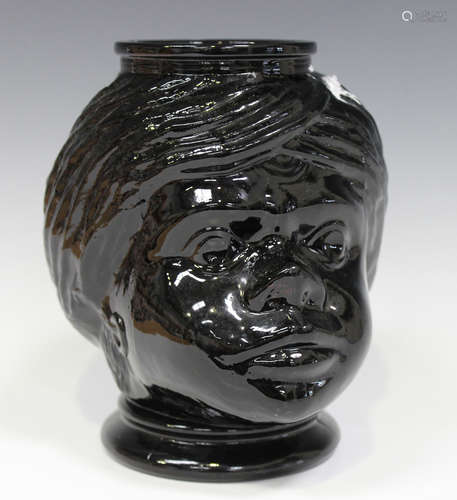 A moulded black glass jar in the form of a woman's head, early to mid-20th century, possibly