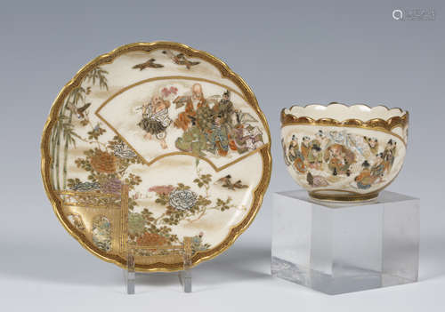 A Japanese Satsuma earthenware cabinet cup and saucer by Kaizan, Meiji period, the cup exterior