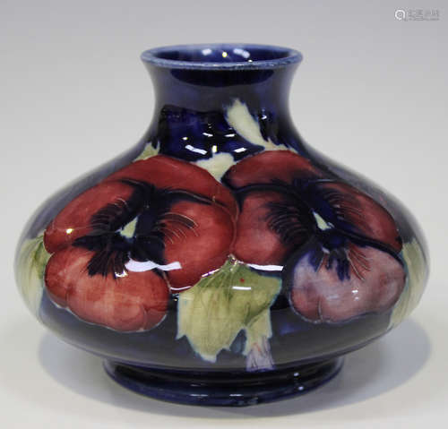 A Moorcroft pottery Pansy pattern vase, circa 1930, of bulbous shape with a blue ground, impressed