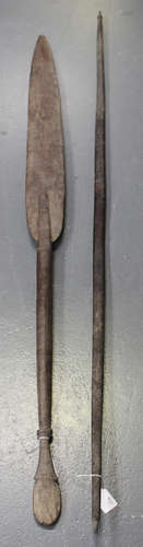 A Solomon Islands carved hardwood paddle with flattened ovoid blade, length 158cm, together with a