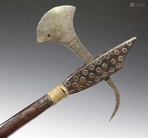 An African hardwood axe, probably late 19th century, the head with overall dot decoration and fitted