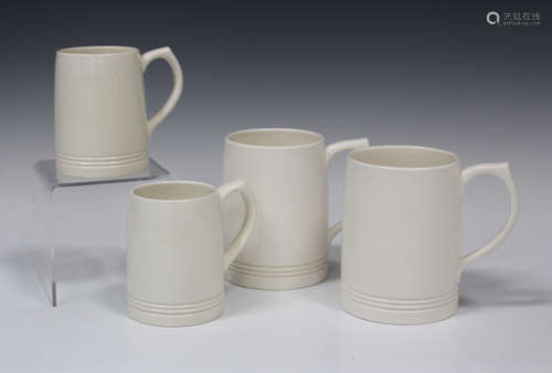 Two pairs of Wedgwood Keith Murray designed mugs, each covered in a Moonstone cream glaze, the