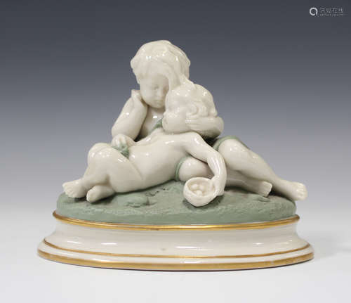 A Royal Worcester porcelain figure group, circa 1867, modelled as two reclining ivory glazed