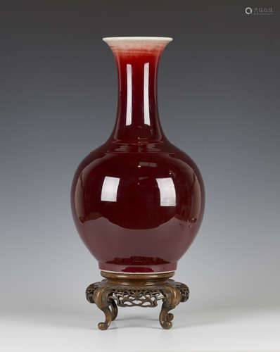 A Chinese sang-de-boeuf glazed bottle vase, mark of Guangxu and probably of the period, the globular