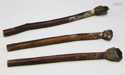 A group of three Australian Aboriginal wooden and clay spatulas, all approx length 25cm (faults).