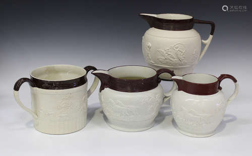 Three white stoneware jugs and a two-handled loving cup, early 19th century, in the style of Turner,