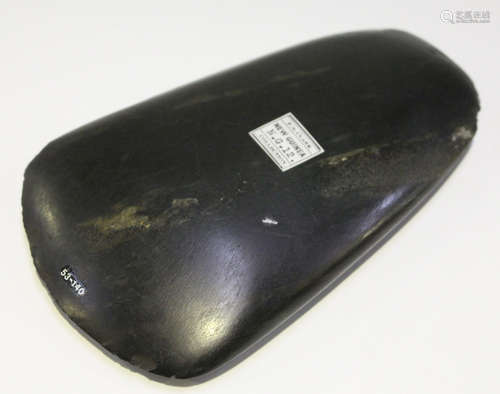 A New Guinea polished stone axe head, bearing 'F.S. Clark Collection' label, detailed 'New