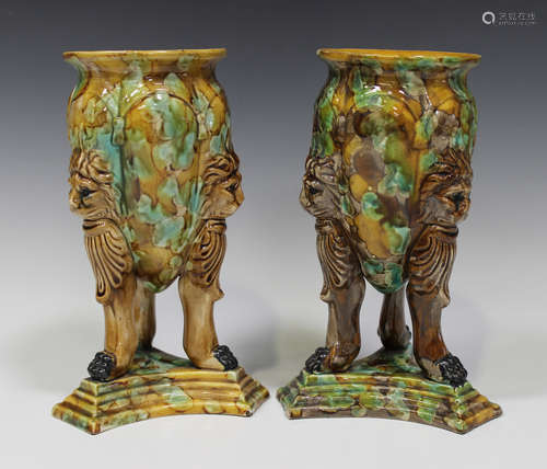 A pair of Continental majolica vases, late 19th century, the tapered, lobed bodies with mottled