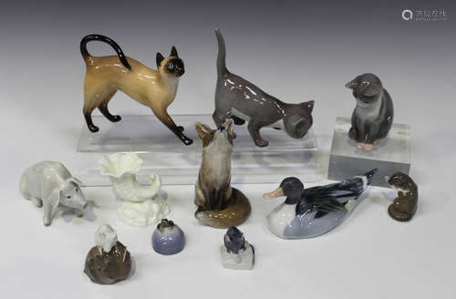 Nine Royal Copenhagen porcelain animals, including a fox looking up, No. 1475, a seated pig, No.