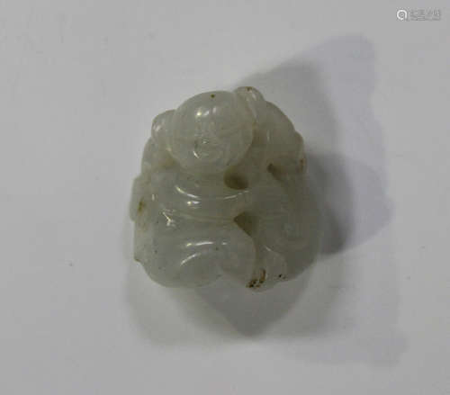 A Chinese pale celadon jade pendant, late Qing dynasty, carved and pierced in the form of a child