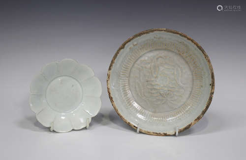 A Chinese Dingyao porcelain circular dish, probably Song dynasty, the centre carved in low relief