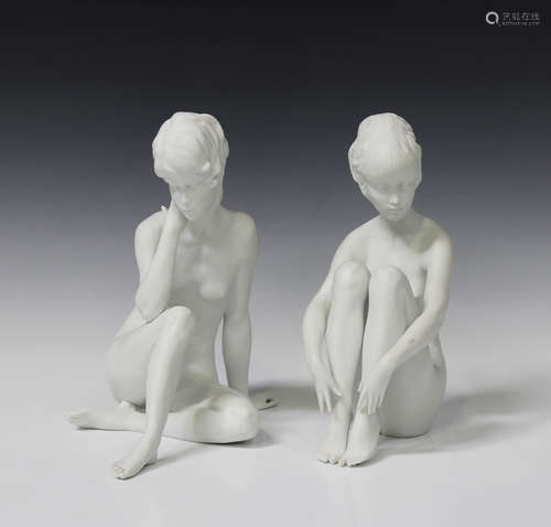 Two Kaiser bisque porcelain figures of seated female nudes, printed and impressed marks to base,