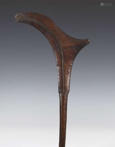 A South Seas dense hardwood war club of unusual gunstock shaped form, 19th century, probably Fijian,