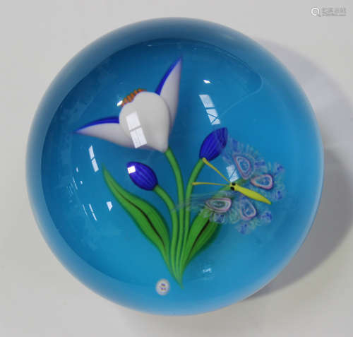 A Baccarat limited edition glass paperweight, dated 1984, decorated with a butterfly hovering next