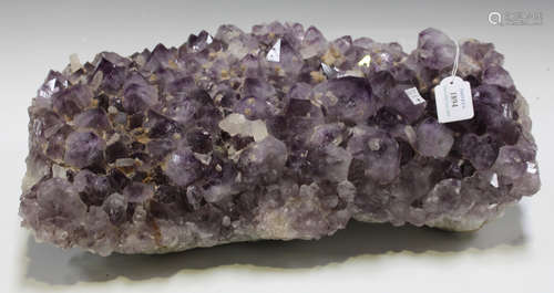 A large specimen of amethyst crystal, length 47cm.Buyer’s Premium 29.4% (including VAT @ 20%) of the