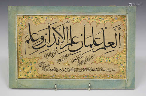 An Islamic illuminated manuscript panel, 19th century, painted in black with lines of script