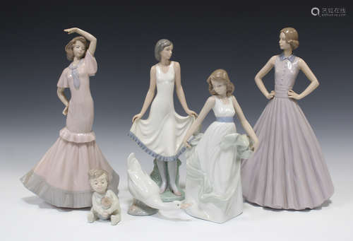 Nine Nao porcelain figures, including five ladies, a baby and a swan, together with two similar