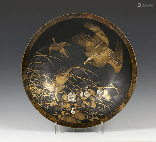 An impressive Japanese inlaid lacquer circular dish, Meiji period, finely lacquered with an eagle