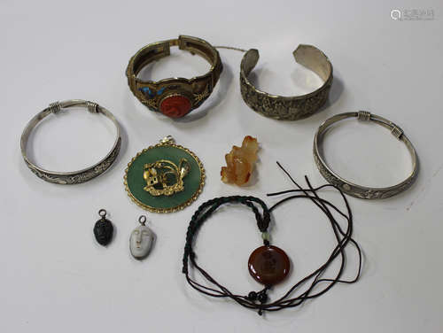 A small group of Chinese jewellery, mostly 20th century, including a silver gilt filigree and enamel