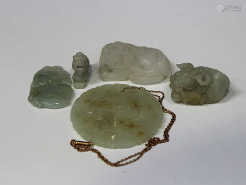 A small group of Chinese jade carvings, Qing dynasty and later, comprising a pale celadon jade