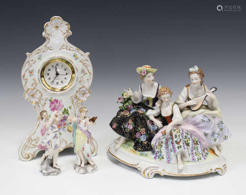 A Dresden porcelain balloon shaped mantel clock, painted with floral sprays, height 28cm, together