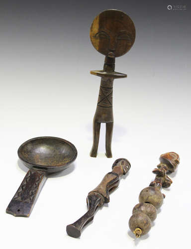 A Luba carved wooden rattle, Democratic Republic of Congo, the handle modelled as a kneeling female,