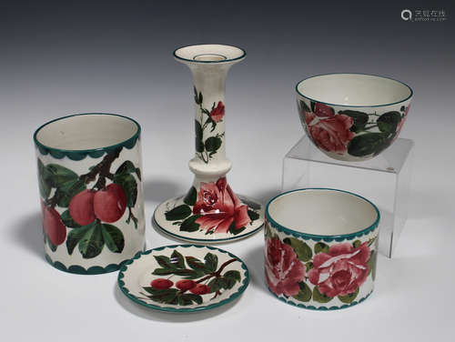 Three pieces of Wemyss pottery, circa 1900, comprising a cylindrical jar, painted with plums, height