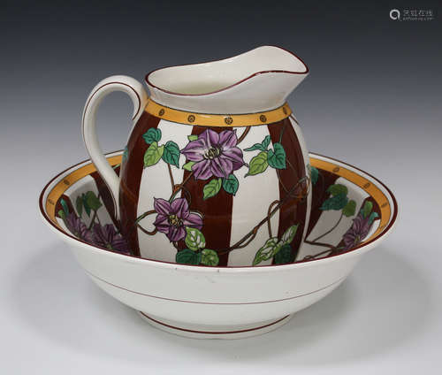 A Mintons pottery Aesthetic wash jug and basin, circa 1880, decorated with trailing purple