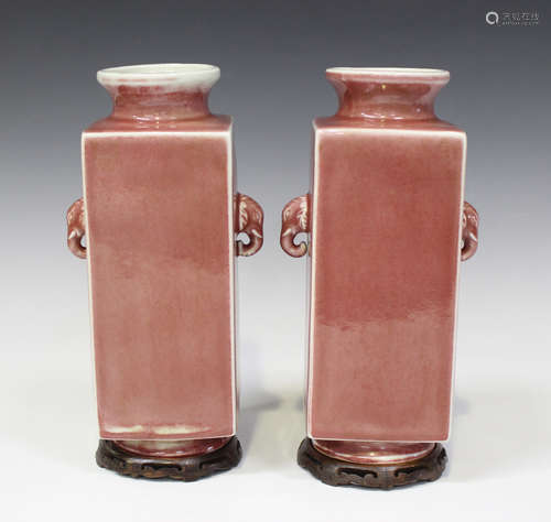 A pair of Chinese peach bloom glazed porcelain cong-shaped vases, mark of Qianlong but 20th century,