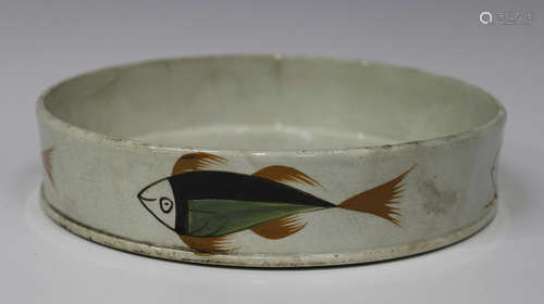 A pearlware char dish, early 19th century, the circular body painted in Pratt type colours with four