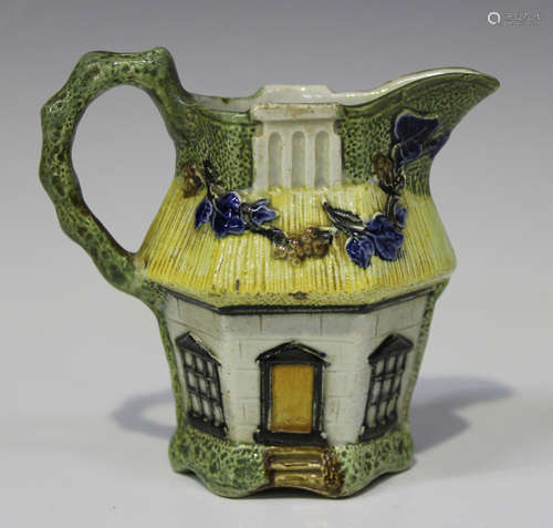 A pearlware Prattware cottage cream jug, circa 1800, of hexagonal form, relief moulded and painted